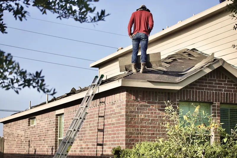 Professional roofer working on a residential roof in Cleveland